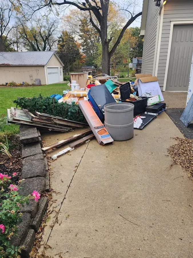 Dumpster being loaded with debris for Commercial Dumpster Rental in Pittsfield